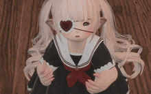 a little girl with a heart shaped eye patch on her left eye