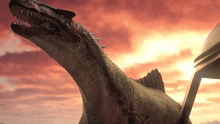 a dinosaur with sharp teeth is standing in front of a cloudy sky .