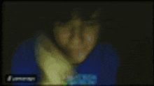 a blurry picture of a person 's face with a facebook logo in the corner .