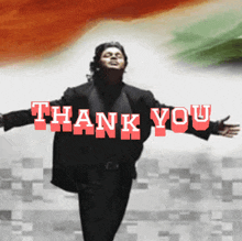 a man with his arms outstretched in front of a thank you sign