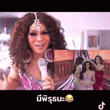 a woman with curly hair is holding a microphone in front of a picture of a woman wearing a crown