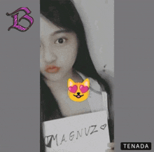 a girl is holding a sign that says magnuz on it