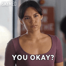 a woman in a purple top is asking if she is okay
