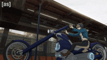 a man is riding a blue motorcycle with the letters as behind him