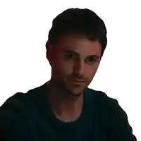 a man with a beard wearing a black shirt