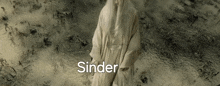a statue of a woman with the word inder written above her