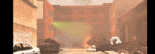 a car is parked in front of a building that is on fire