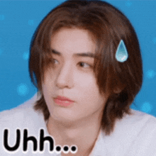 a man with long hair has a drop of sweat on his forehead and the word uhh on the bottom