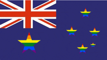 a british flag with a rainbow star in the middle