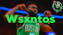 a boston celtics basketball player flexes his muscles in a green jersey