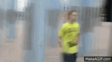 a man in a neon yellow shirt is running