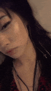 a close up of a woman 's face with her eyes closed