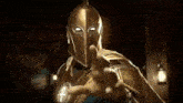 a man in a golden helmet and armor is pointing his finger at the camera .