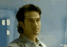 a close up of a man 's face with the words rbd.gif below it .