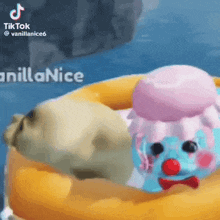 a seal is laying on a float in the water with a clown .