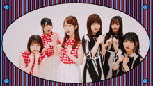 a group of young women are posing for a picture in a striped frame