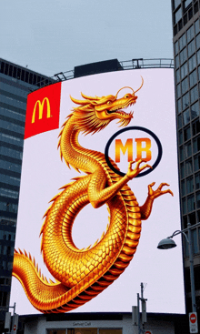 a large mcdonald 's billboard with a golden dragon holding a mb logo