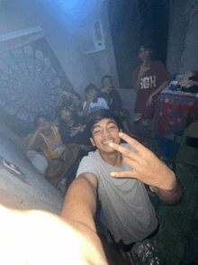 a group of young men are posing for a picture with one wearing a jersey that says los angeles