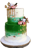 a green and white cake with flowers and gold dripping