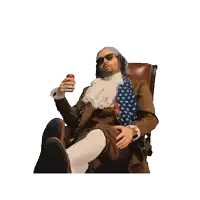 a man in a wig and sunglasses is sitting in a chair and pointing at something