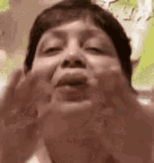 a close up of a woman making a funny face .