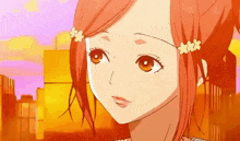 a close up of a girl 's face with a flower in her hair