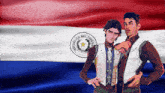two men standing in front of a flag that says republica del paraguay on it