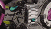 a close up of a robot with a pink helmet on it