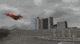 a cartoon character is flying over a city with a sign that says ' a ' on it