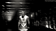 a black and white photo of a person 's face with the words `` the next big thing '' on the bottom .