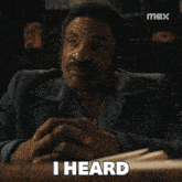 a man sitting at a table with the words about what you did written on his face