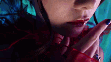 a close up of a woman 's face with red lips