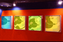 a row of colorful posters on a wall with one that says ccc