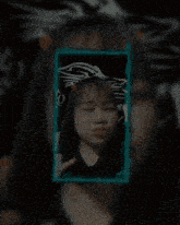 a girl is making a funny face in a picture frame with a dragon on it