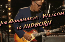 a man playing a guitar with the words joe bonamassa welcome to 2ndborn