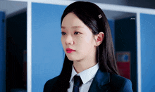 a girl in a school uniform with a headband that says ' a ' on it