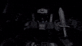a robot with a gun and a sword is shooting a beam of light .