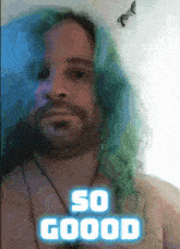 a man with green hair and a beard is smiling with the words so good above him