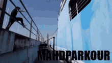 a man is doing a trick on a railing and the words mahdparkour are on the bottom