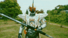 a man in a white armor is holding a sword