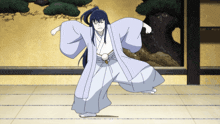 a cartoon character in a kimono is dancing