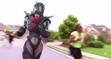 a woman in a superhero costume is walking down the street .