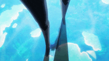 a person 's feet are visible in the water