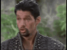 a man says " you 're going too gabrielle " in front of a green background