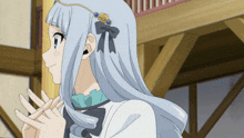 a girl with long white hair and a bow on her head