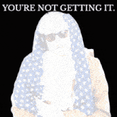 a man in an american flag costume with the words " you 're not getting it " above him