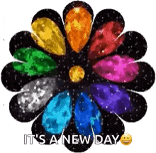 a colorful flower with the words `` it 's a new day '' written on it