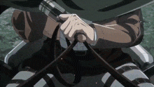 a close up of a person holding a sword in their hands in a cartoon .