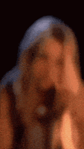 a blurry picture of a man 's face with a beard