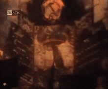 a blurred image of a fire with a 24 ack watermark